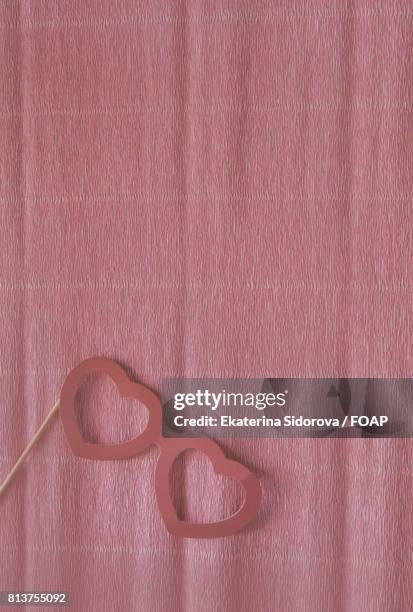 eye mask on pink crepe paper - crepe paper stock pictures, royalty-free photos & images