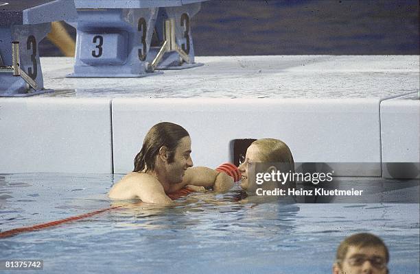 Swimming: 1976 Summer Olympics, GDR Roland Matthes and Kornelia Ender in water after practice, Montreal, CAN 7/17/1976--7/31/1976