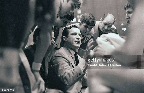 College Basketball: NCAA Playoffs, North Carolina coach Dean Smith in huddle with team during timeout of game vs Davidson, College Park, MD 3/15/1969