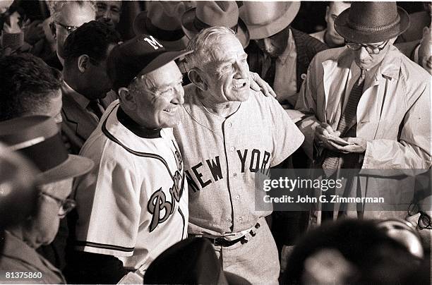 Baseball: World Series, New York Yankees manager Casey Stengel victorious with Milwaukee Braves manager Fred Haney during press conference after...