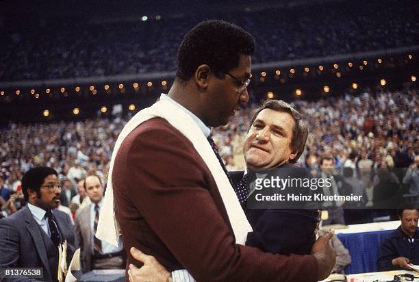 College Basketball: NCAA Final Four, Closeup of North Carolina coach Dean Smith victorious with Georgetown coach John Thompson after game, New...