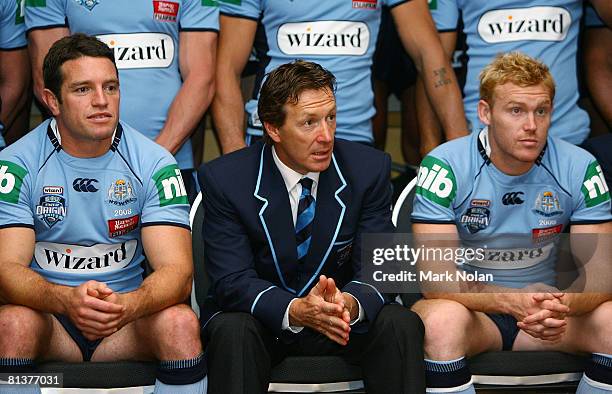 Danny Buderus, Craig Bellamy and Peter Wallace look on while waiting for a team photo during a New South Wales Blues State of Origin media session at...