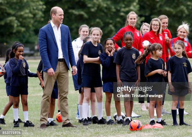 Prince William, Duke of Cambridge attends a kick-about with the Lionesses and local girls team from the Wildcats Girl' Football programme on July 13,...