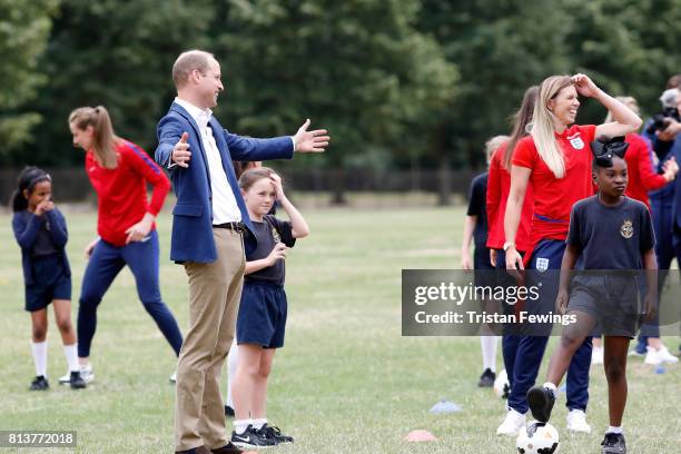 Prince William, Duke of Cambridge attends a kick-about with the Lionesses and local girls team from the Wildcats Girl' Football programme on July 13,...