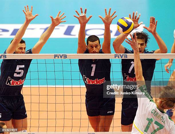 Paul Carroll of Australia spikes against Luigi Mastrangelo of Italy during the FIVB Men's World Olympic Qualification Tournament match between...