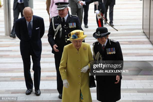 Britain's Queen Elizabeth II arrives with Metropolitan Police Commissioner Cressida Dick accompanied by Britain's Prince Philip, Duke of Edinburgh...