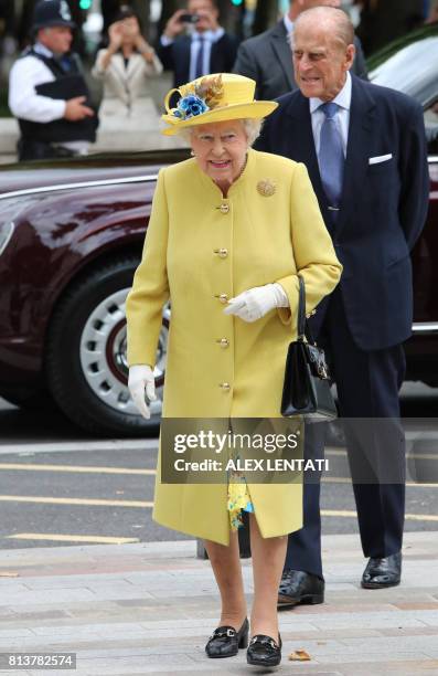 Britain's Queen Elizabeth II arrives accompanied by Britain's Prince Philip, Duke of Edinburgh to open the new headquarters of the Metropolitan...