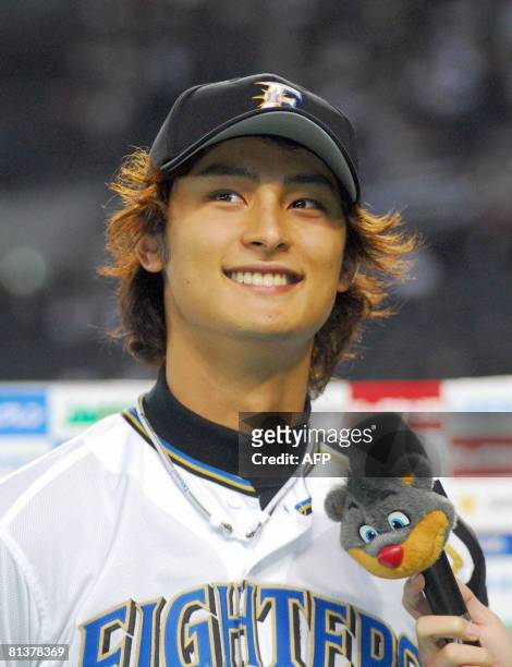 Japanese professional baseball team Hokkaido Nippon Ham Fighters pitcher Darvish Yu smilings during the post-game interview after his win over the...