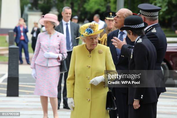 Queen Elizabeth II and Prince Philip, Duke of Edinburgh are greeted by Commissioner of the Metropolitan Police Cressida Dick and Deputy Commissioner...