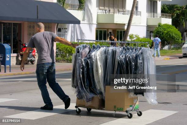 Person Pushing Garment Rack 1,247 Plastic Rack Stock Photos, High-Res Pictures, and Images - Getty ...