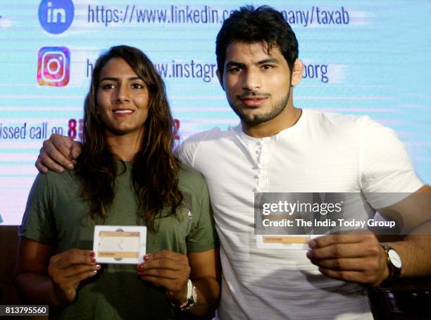 India's first Commonwealth Games wrestling gold medallist Geeta Phogat with her husband Pawan Kumar takes an oath not to have more than two children...