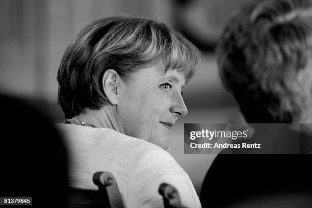 German Chancellor Angela Merkel smiles at Leipzig city hall on June 3, 2008 in Leipzig, Germany. Merkel received the honorary Doctorate for her...