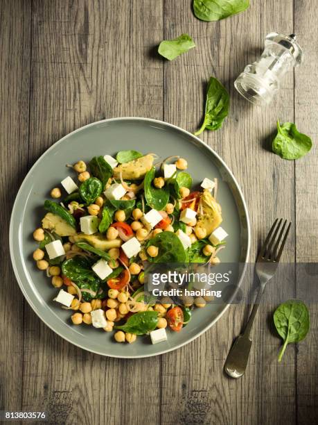 chickpea with artichokes and spinach salad - chick pea salad stock pictures, royalty-free photos & images