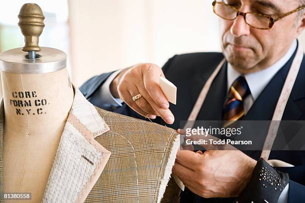 tailor chalks unfinished jacket shoulder - sastre fotografías e imágenes de stock