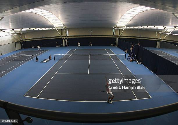 General view as the final rounds of qualifying are played indoors at the National Tennis Centre after bad weather prevented play at Surbiton during...