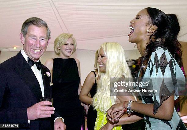 The Prince of Wales shares a joke with supermodels Sophie Dahl , Naomi Campbell and fashion designer Donatella Versace , at the 'Its Fashion' charity...