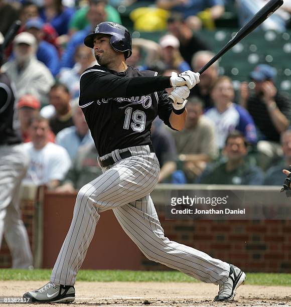 Ryan Spilborghs of the Colorado Rockies hits the ball against the Chicago Cubs on May 30, 2008 at Wrigley Field in Chicago, Illinois. The Cubs...