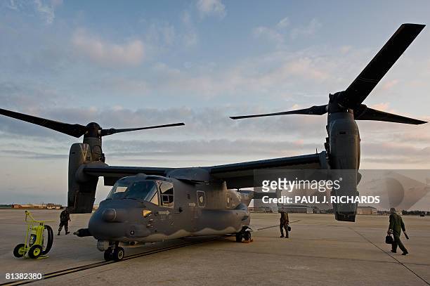 The crew walks towards their US Air Force CV-22 Osprey tiltrotor aircraft as it sits on the tarmac at MacDill AFB in Tampa Florida on May 21, 2008....