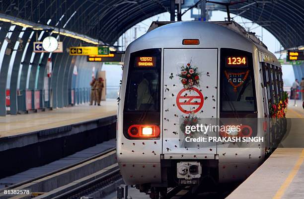 Decorated train of the Delhi Metro waits for the flag off during the inauguration of an extension of The Rithala-Shahadra metro line at Dilshad...