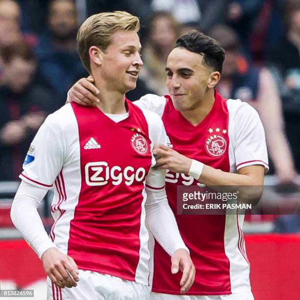Ajax's Dutch midfielder Abdelhak Nouri and Frenkie de Jong react during a football match in Amsterdam on May 7, 2017. - Abdelhak Nouri has suffered...