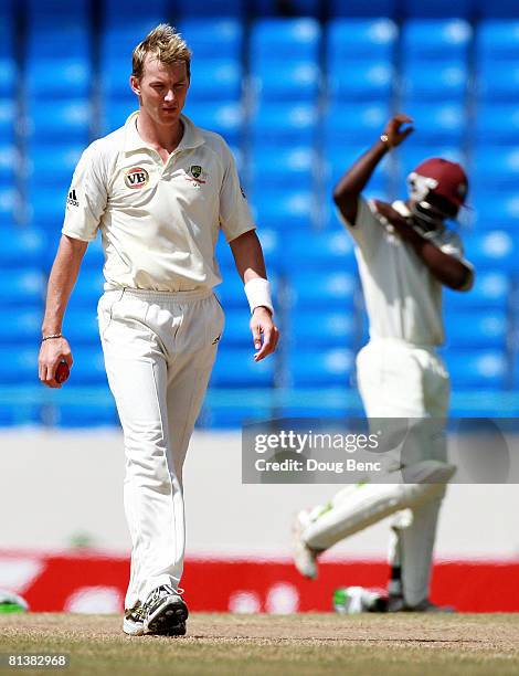 Brett Lee of Australia walks away as Devon Smith of West Indies holds his shoulder after being hit by Lee on day five of the Second Test match...