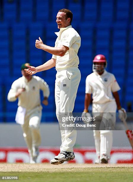 Stuart Clark of Australia celebrates with teammates after dismissing Xavier Marshall of West Indies on day five of the Second Test match between West...