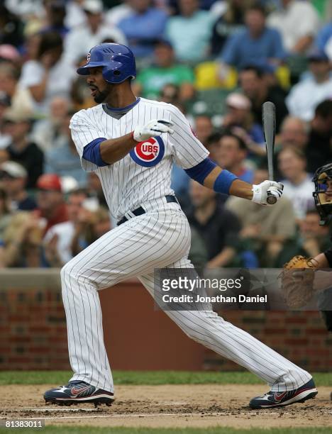 Derrek Lee of the Chicago Cubs hits the ball against the Colorado Rockies on May 30, 2008 at Wrigley Field in Chicago, Illinois. The Cubs defeated...