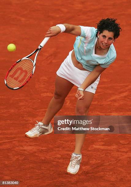 Carla Suarez Navarro of Spain serves during the Women's Singles Quarter Final match against Jelena Jankovic of Serbia on day ten of the French Open...