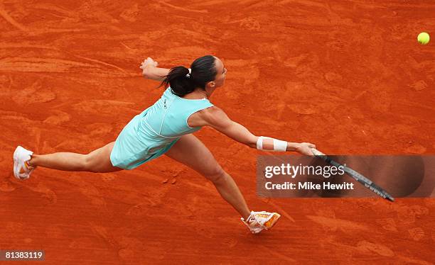 Jelena Jankovic of Serbia stretches for a forehand during the Women's Singles Quarter Final match against Carla Suarez Navarro of Spain on day ten of...