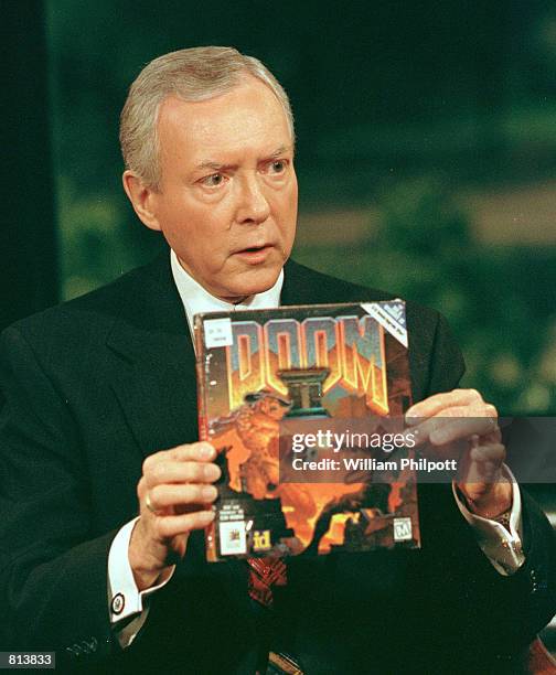 Senator Orrin Hatch holds a copy of the popular computer game ''Doom'' during a discussion on violence in the American culture on Fox News Sunday May...
