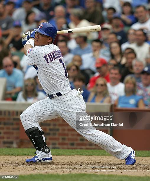 Kosuke Fukudome of the Chicago Cubs hits the ball against the Colorado Rockies on May 30, 2008 at Wrigley Field in Chicago, Illinois. The Cubs...