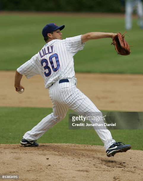 Starting pitcher Ted Lilly of the Chicago Cubs delivers the ball against the Colorado Rockies on May 30, 2008 at Wrigley Field in Chicago, Illinois....