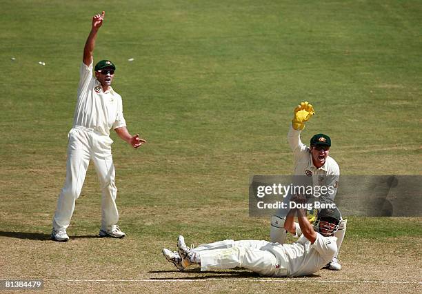 Michael Hussey, Phil Jaques and wicketkeeper Brad Haddin of Australia appeal to the umpire on a caught ball on day five of the Second Test match...