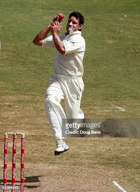 Michael Hussey of Australia bowls on day five of the Second Test match between West Indies and Australia at Sir Vivian Richards Stadium on June 3,...