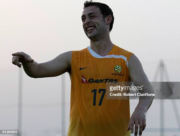 Scott McDonald of Australia fools around with his teammates during an Australian Socceroos training session held at the Jebel Ali International...