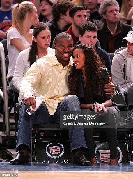 Osi Umenyiora and Selita Ebanks attends Memphis Grizzlies vs NY Knicks game at Madison Square Garden on March 21, 2008 in New York City.