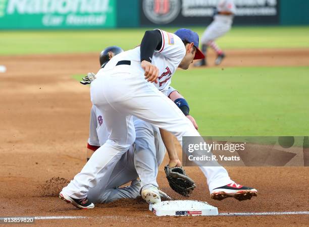 Pete Kozma of the Texas Rangers misses the tag in the second inning on Christian Vazquez of the Boston Red Sox at Globe Life Park in Arlington on...