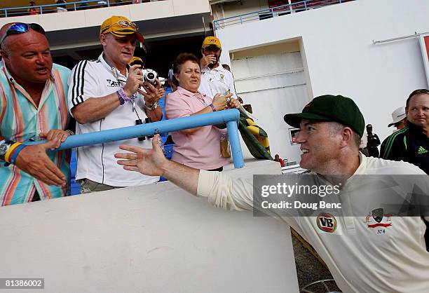 Stuart MacGill of Australia shakes hands with some fans after day five of the Second Test match between West Indies and Australia at Sir Vivian...