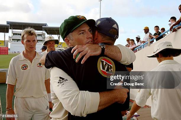 Stuart MacGill of Australia gets a hug from a team member after day five of the Second Test match between West Indies and Australia at Sir Vivian...