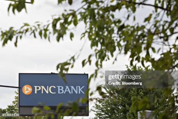 Financial Services Group Inc. Signage is displayed outside a bank branch in Morton, Illinois, U.S., on Monday, July 10, 2017. PNC Financial Services...