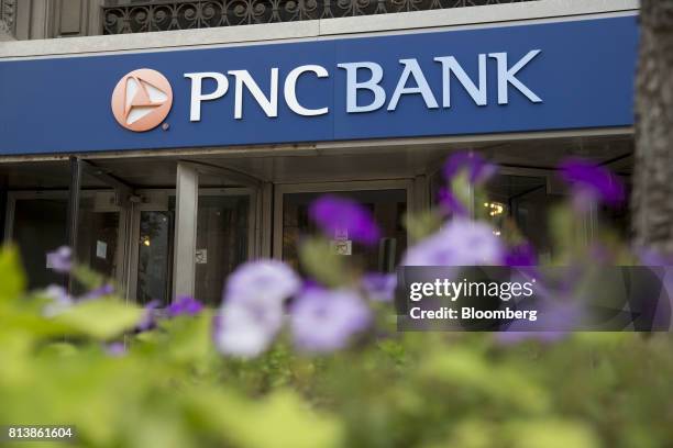 Financial Services Group Inc. Signage is displayed on the exterior of a bank branch in Peoria, Illinois, U.S., on Monday, July 10, 2017. PNC...