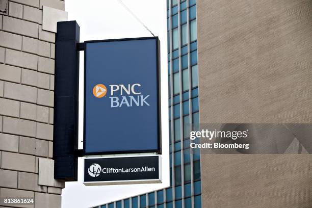 Financial Services Group Inc. Signage is displayed outside a bank branch in Peoria, Illinois, U.S., on Monday, July 10, 2017. PNC Financial Services...