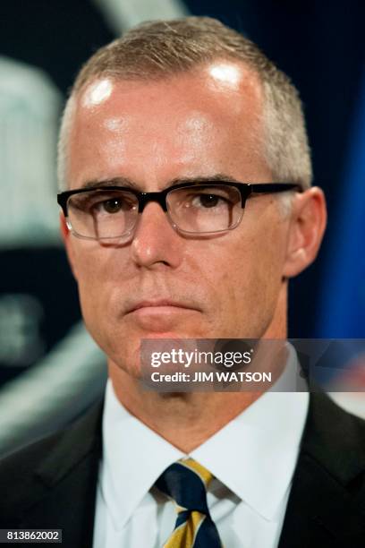 Acting Director of the Federal Bureau of Investigation Andrew McCabe speaks during a press conference at the US Department of Justice in Washington,...