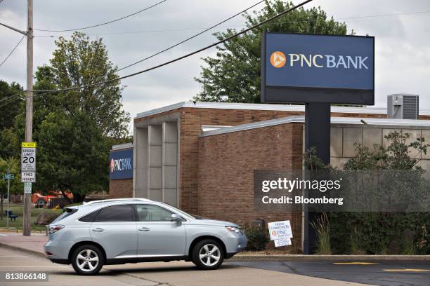 Vehicle enters a PNC Financial Services Group Inc. Bank branch parking lot in Morton, Illinois, U.S., on Monday, July 10, 2017. PNC Financial...