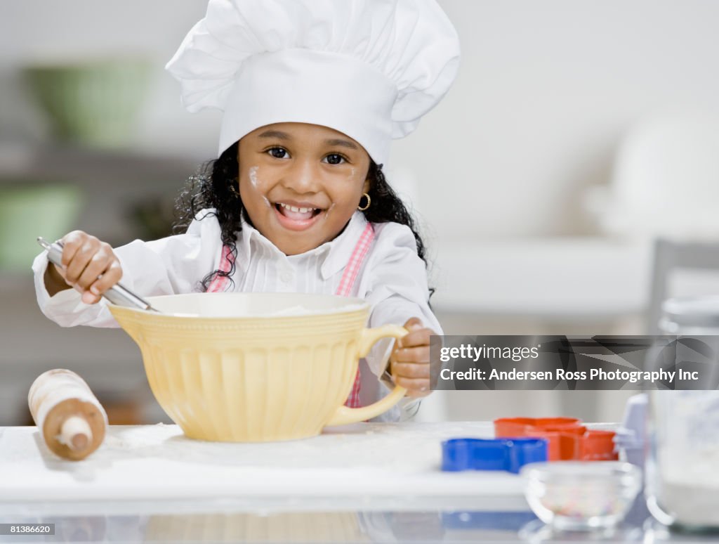 African girl mixing batter