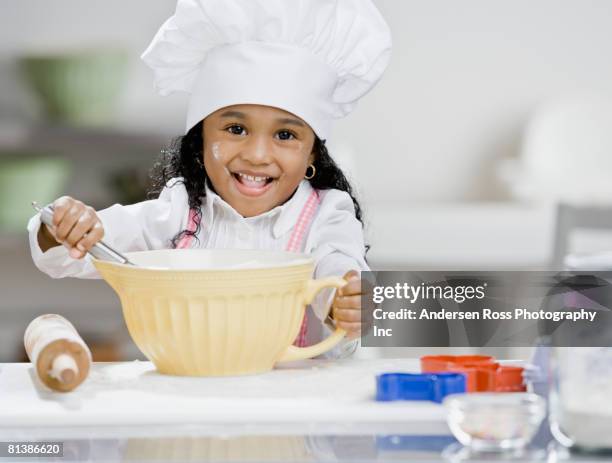 african girl mixing batter - girl baking stock pictures, royalty-free photos & images