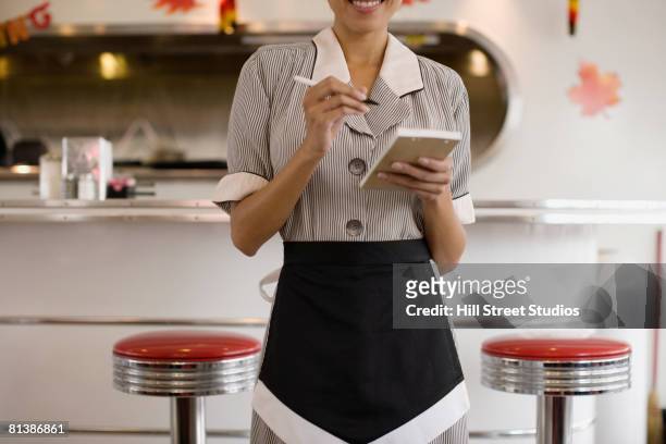 asian waitress taking order - ウエイトレス ストックフォトと画像