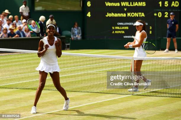 Venus Williams of The United States victory as Johanna Konta of Great Britain looks dejected during the Ladies Singles semi final match on day ten of...