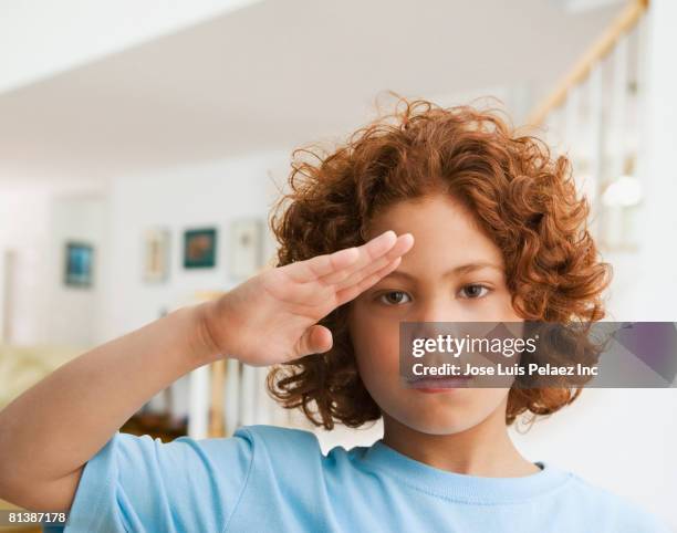 mixed race boy saluting - child saluting stock pictures, royalty-free photos & images