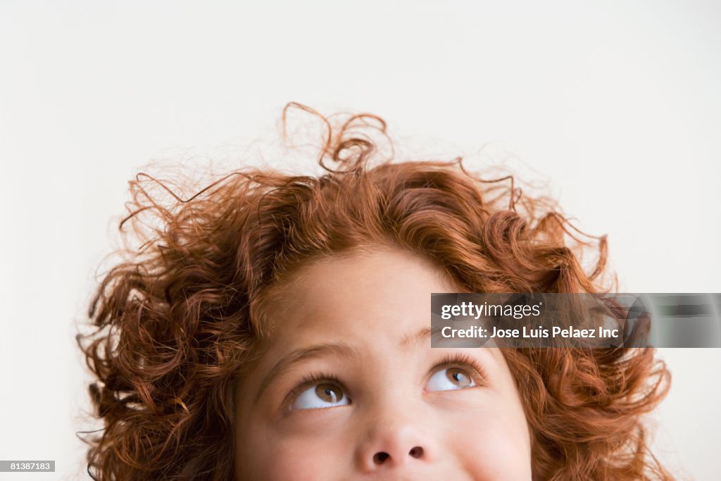 Mixed Race boy looking up